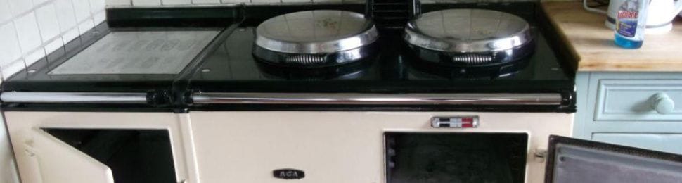 a perfectly cleaned aga cooker with opened doors